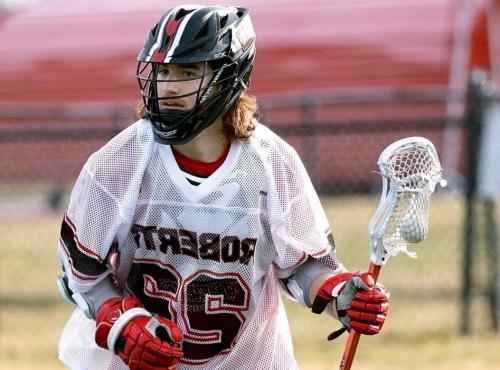 Gunner MacMillan plays lacrosse